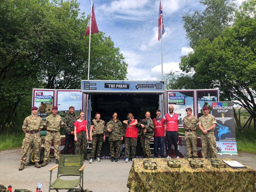Katie, Claire, and Jess from Handsfree Group posing with other staff and the Northern Covenant members at the Armed Forces Week leadership event.