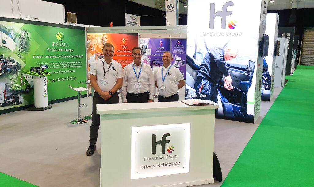 Photo of Craig Thomas, Scott Cassell, and Robert Kelly at the Road Transport Expo on Handsfree Groups exhibition stand.